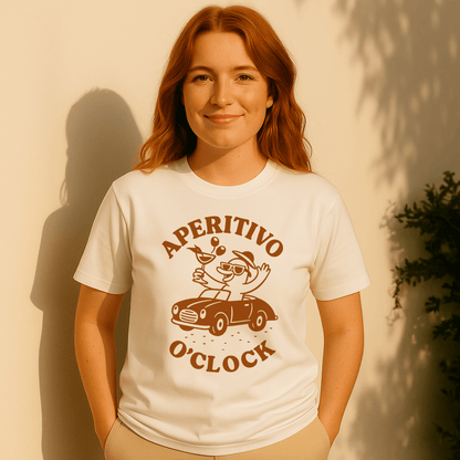 Woman wearing a white t-shirt with 'Aperitivo O'Clock' design against a beige wall.